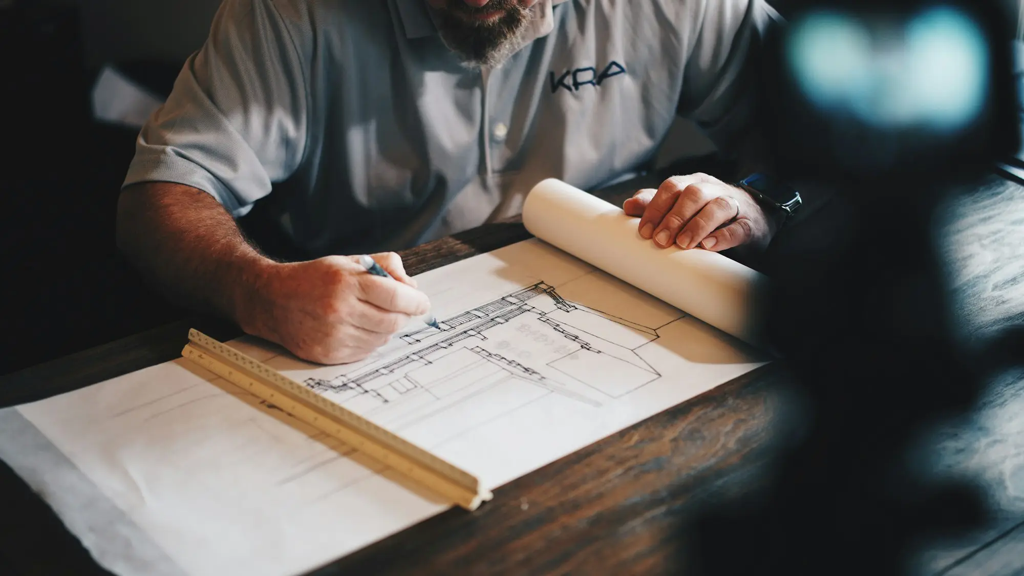 Builder marking up plans for a clinic fit-out