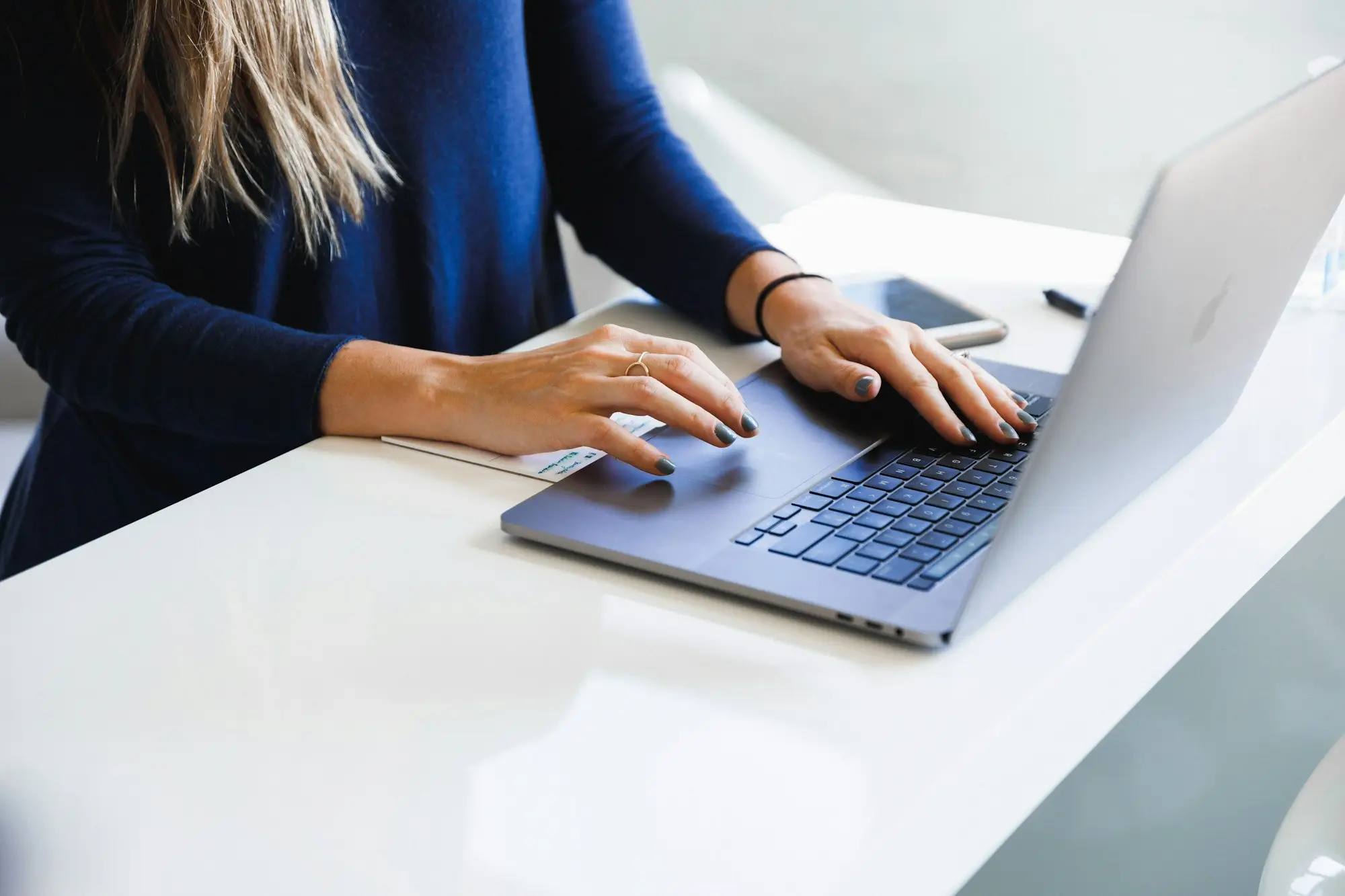 Practice manager reviewing accounts on a laptop